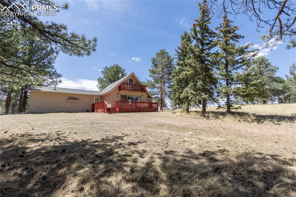 442 Due S Road Florissant, CO 80816 - Photo 7 of 43 a house with trees in the background