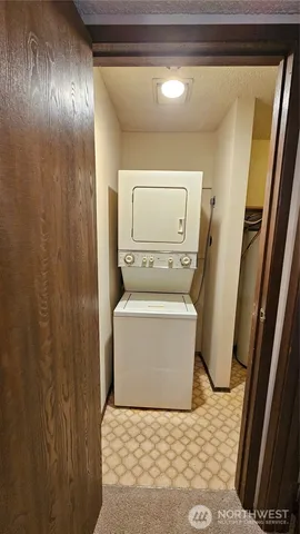 a bathroom with a double vanity sink mirror and toilet