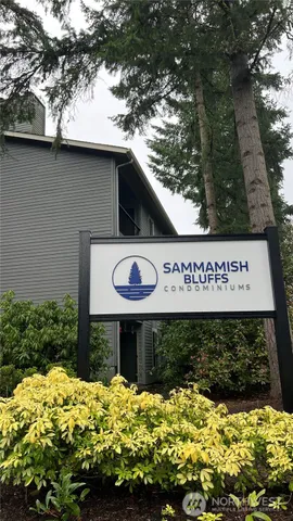 an empty room with closet and windows