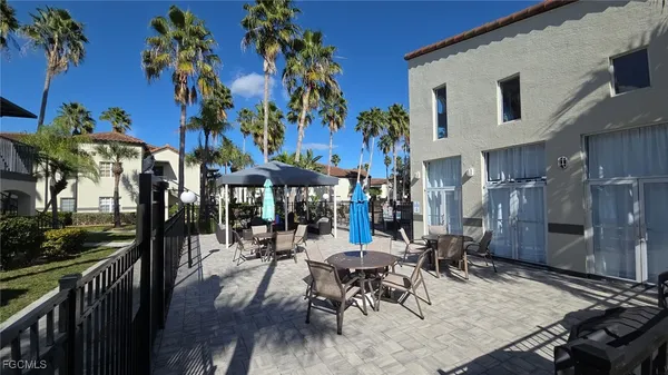 a view of a chairs and tables in patio