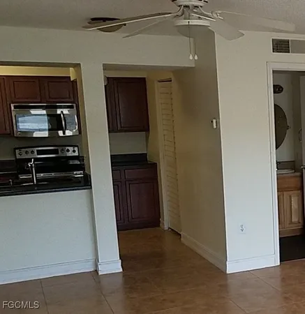 a view of a kitchen from the hallway