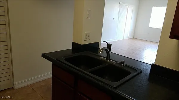 a close view of a sink and dishwasher in a kitchen