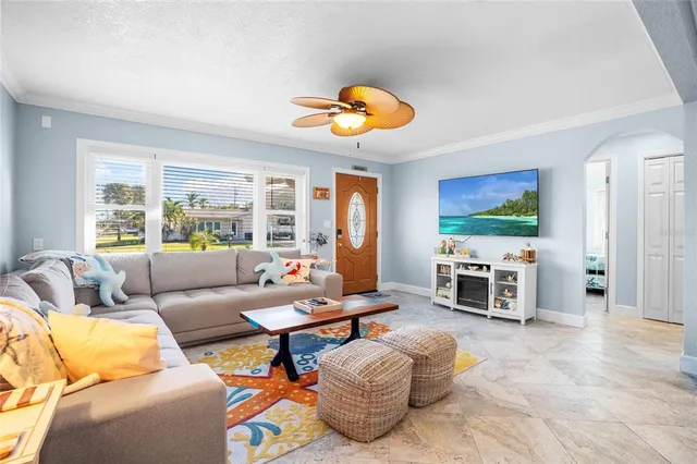 a living room with furniture and a flat screen tv