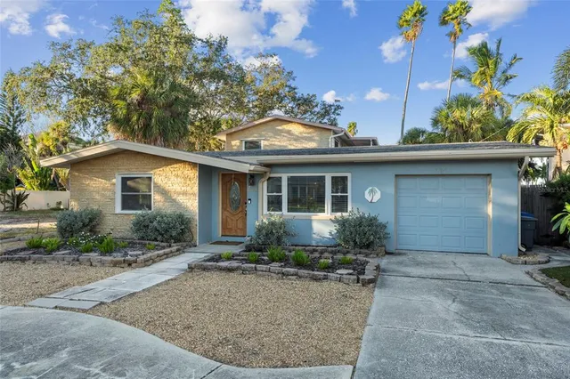 front view of house with potted plants
