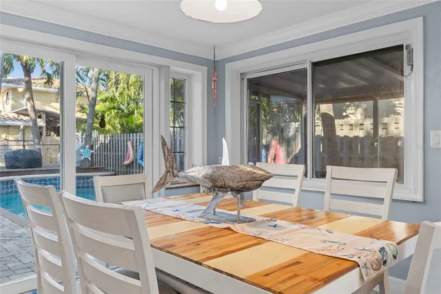 a kitchen with a sink and a potted plant on it