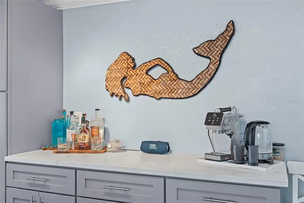 a living room with furniture a couch and a chandelier