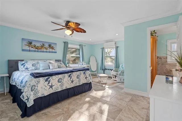 a bedroom with a large bed and a window