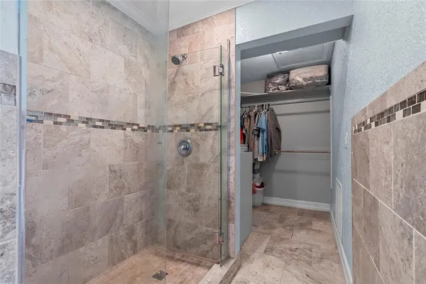 a view of a chairs and table in a balcony