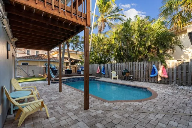 a view of a patio with chairs and a table and chairs