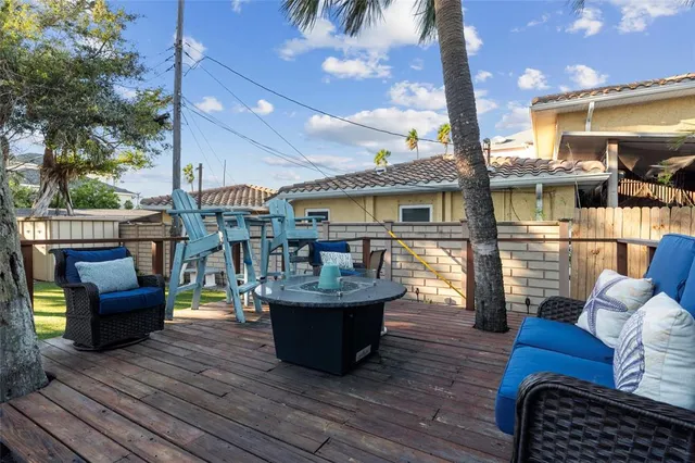 a view of a house with swimming pool and sitting area