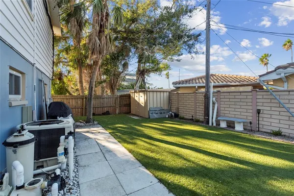 a kitchen with a refrigerator and white cabinets