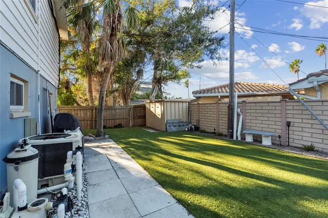 a kitchen with a refrigerator and white cabinets