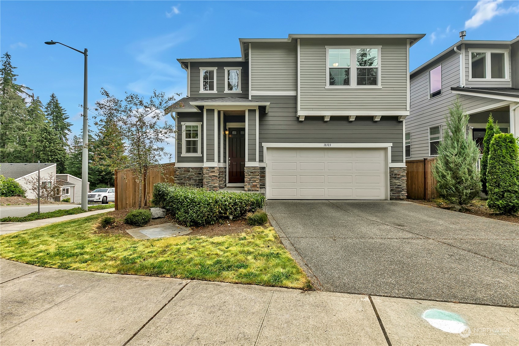 18103 Baldwin Road Bothell, WA 98012 - Photo 1 of 39 a front view of a house with garden