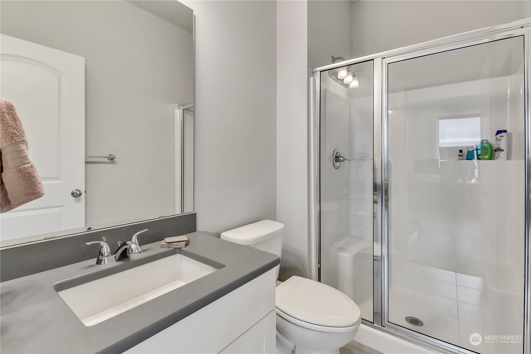 18103 Baldwin Road Bothell, WA 98012 - Photo 29 of 39 a bathroom with a sink toilet vanity and shower