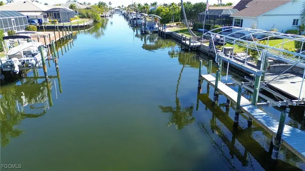 a view of houses with an ocean