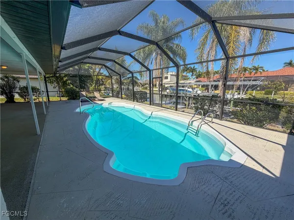 a view of a swimming pool with a patio