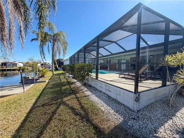 a view of a swimming pool with a patio