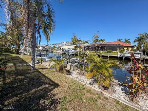 a view of a chairs and table in patio