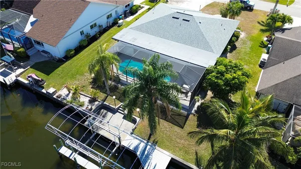 an aerial view of house with yard