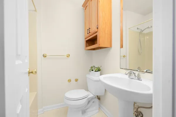 a bathroom with a sink a toilet and a bathtub