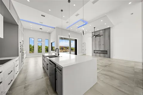 a kitchen with cabinets and stainless steel appliances