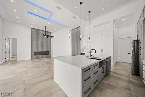 a kitchen with stainless steel appliances white cabinets and a stove