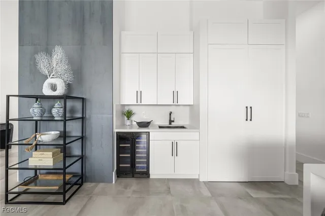 a kitchen with stainless steel appliances cabinets and a table