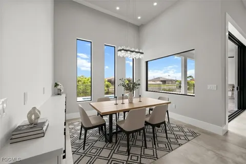a view of a hallway with chandelier