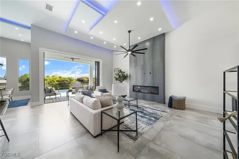 a view of a big house with a big yard and potted plants