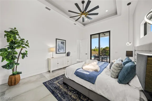 a spacious bathroom with double vanity a sink a mirror a bathtub and a shower