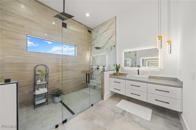 a bathroom with a toilet a sink and shower