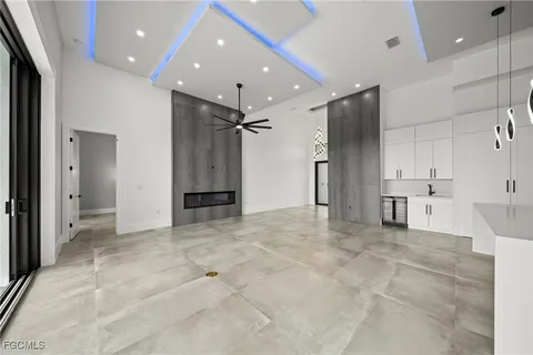 a view of a big room with a cabinet and mirrors