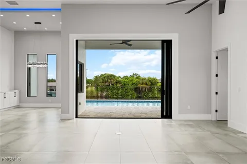 a kitchen with a sink a counter space appliances and cabinets