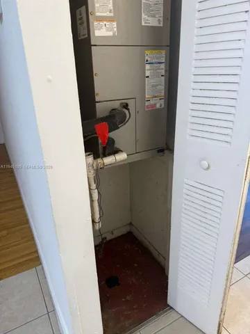 a view of a hallway and closet with a yard