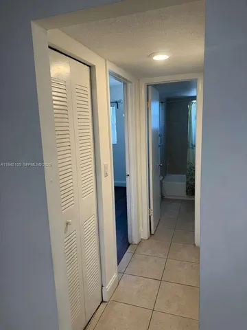 a bathroom with a toilet a sink and shower