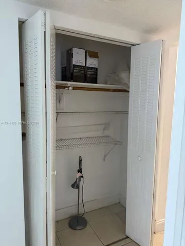 a room with a window and wooden floor