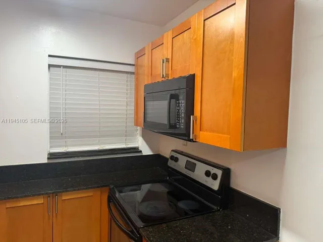 a view of a living room with a flat screen tv