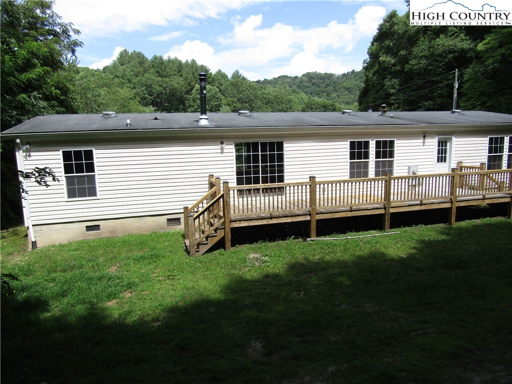 311 Walter Blevins Road Lansing, NC 28643 - Photo 6 of 22 a view of a backyard with a garden