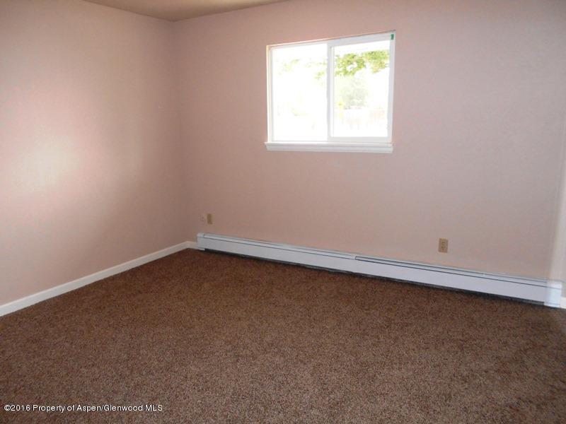 715 West 5th Street Rifle, CO 81650 - Photo 4 of 11 an empty room with a window