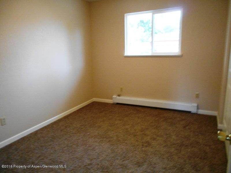 715 West 5th Street Rifle, CO 81650 - Photo 6 of 11 an empty room with a window