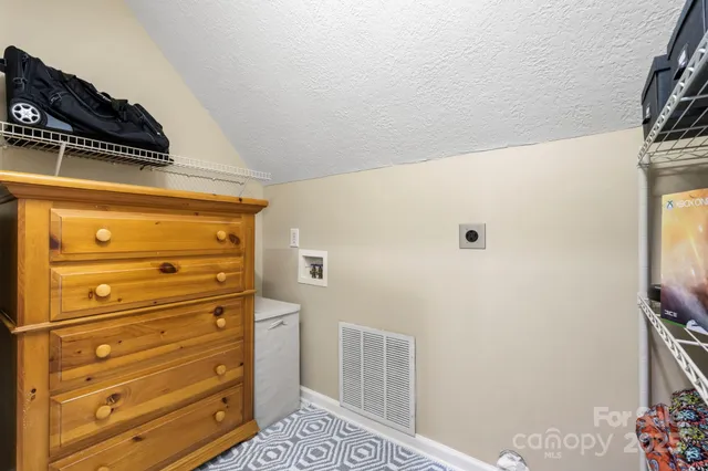 a view of a house with a yard and plants