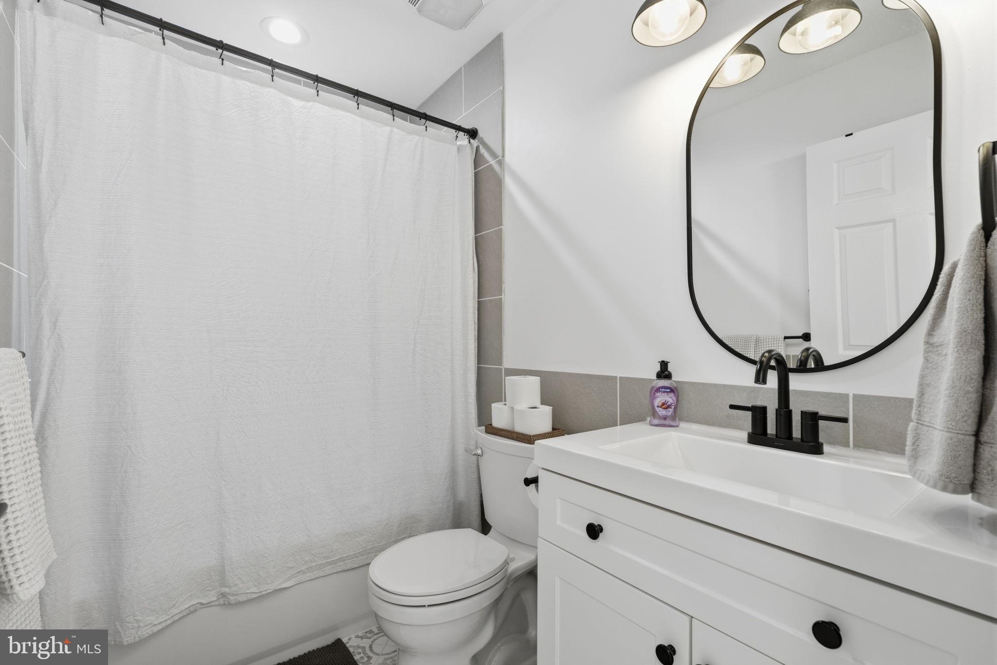 9337 Andover Road Philadelphia, PA 19114 - Photo 19 of 33 Modern elegance in a serene bathroom.