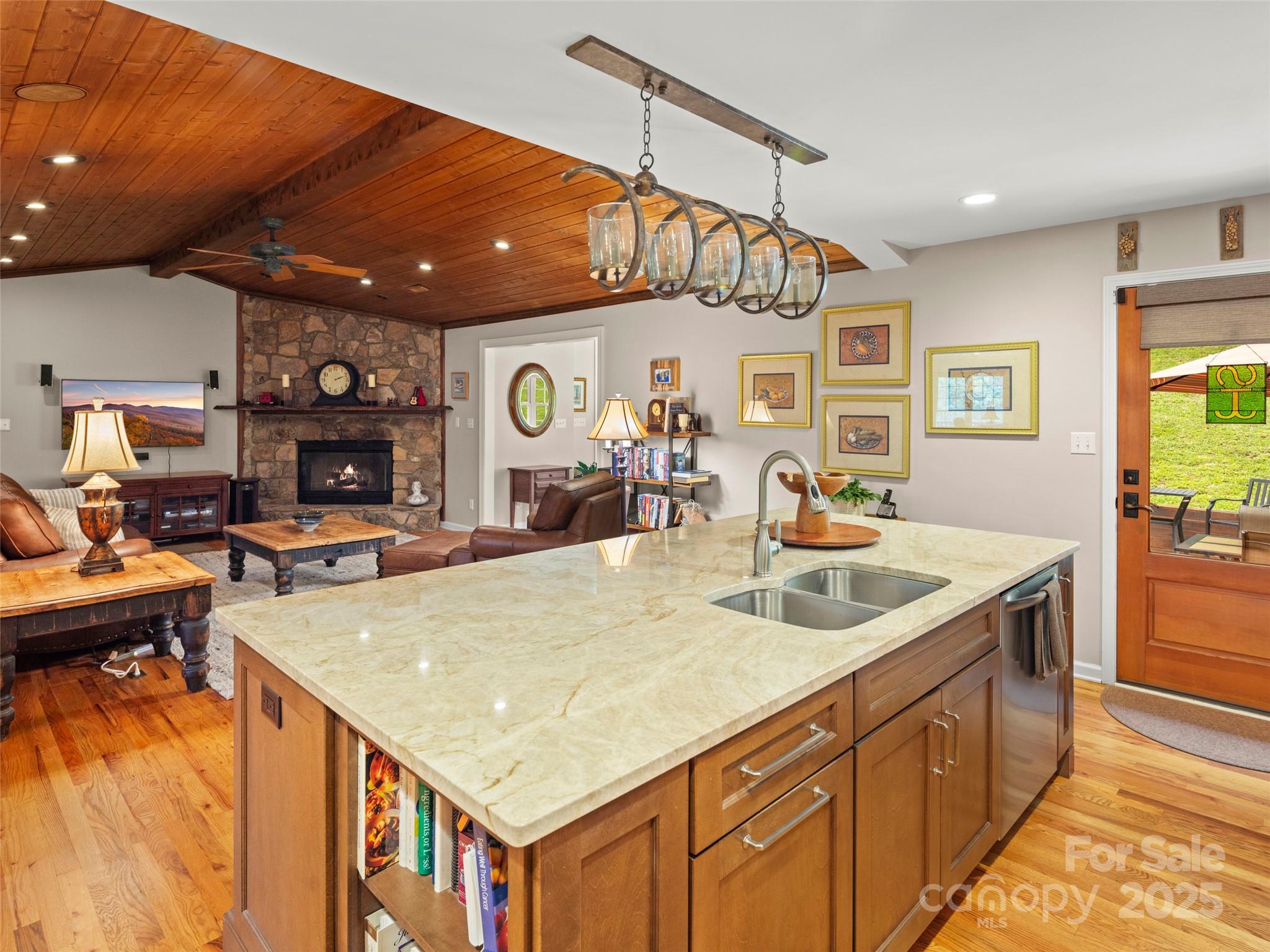 298 Lone Pine Road Alexander, NC 28701 - Photo 13 of 48 a kitchen with a sink a counter space and stainless steel appliances