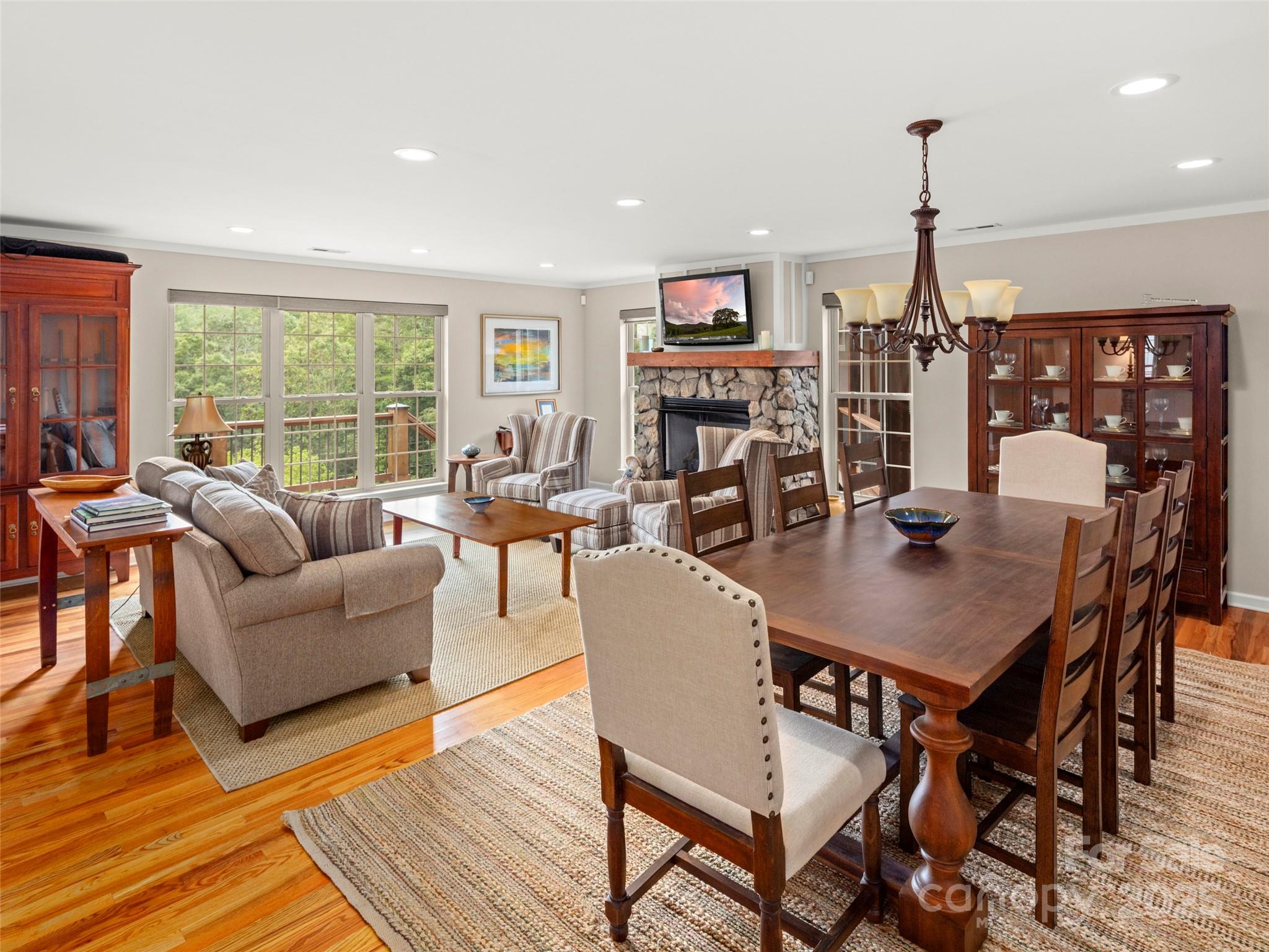 298 Lone Pine Road Alexander, NC 28701 - Photo 17 of 48 a living room with fireplace furniture and a wooden floor
