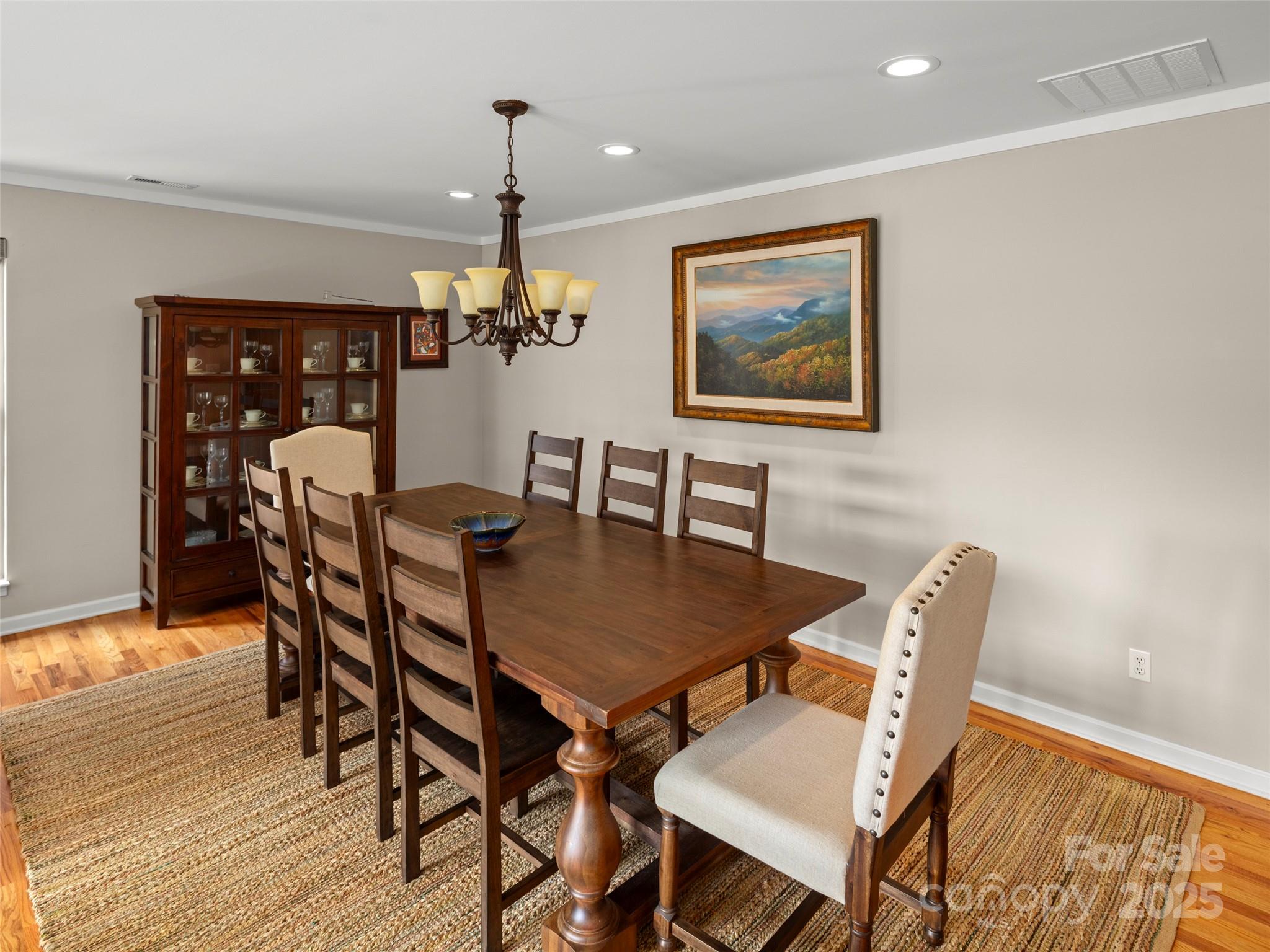 298 Lone Pine Road Alexander, NC 28701 - Photo 20 of 48 a dining room with furniture a chandelier and wooden floor