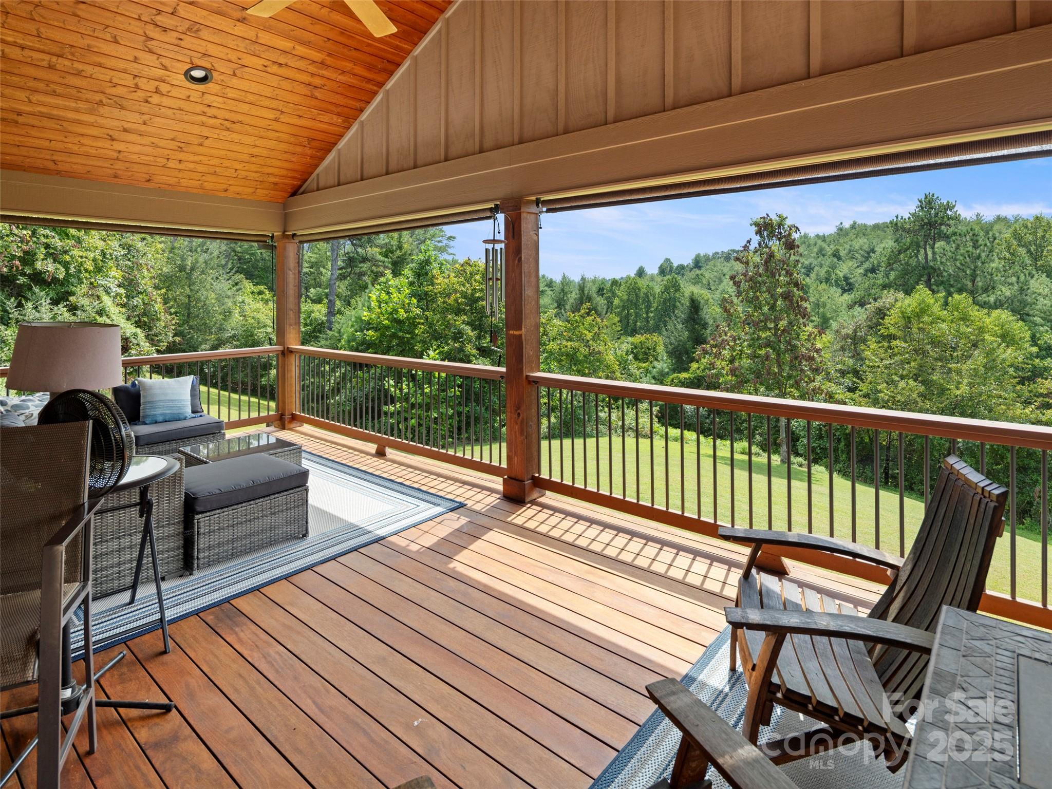 298 Lone Pine Road Alexander, NC 28701 - Photo 22 of 48 a balcony with furniture and wooden floor