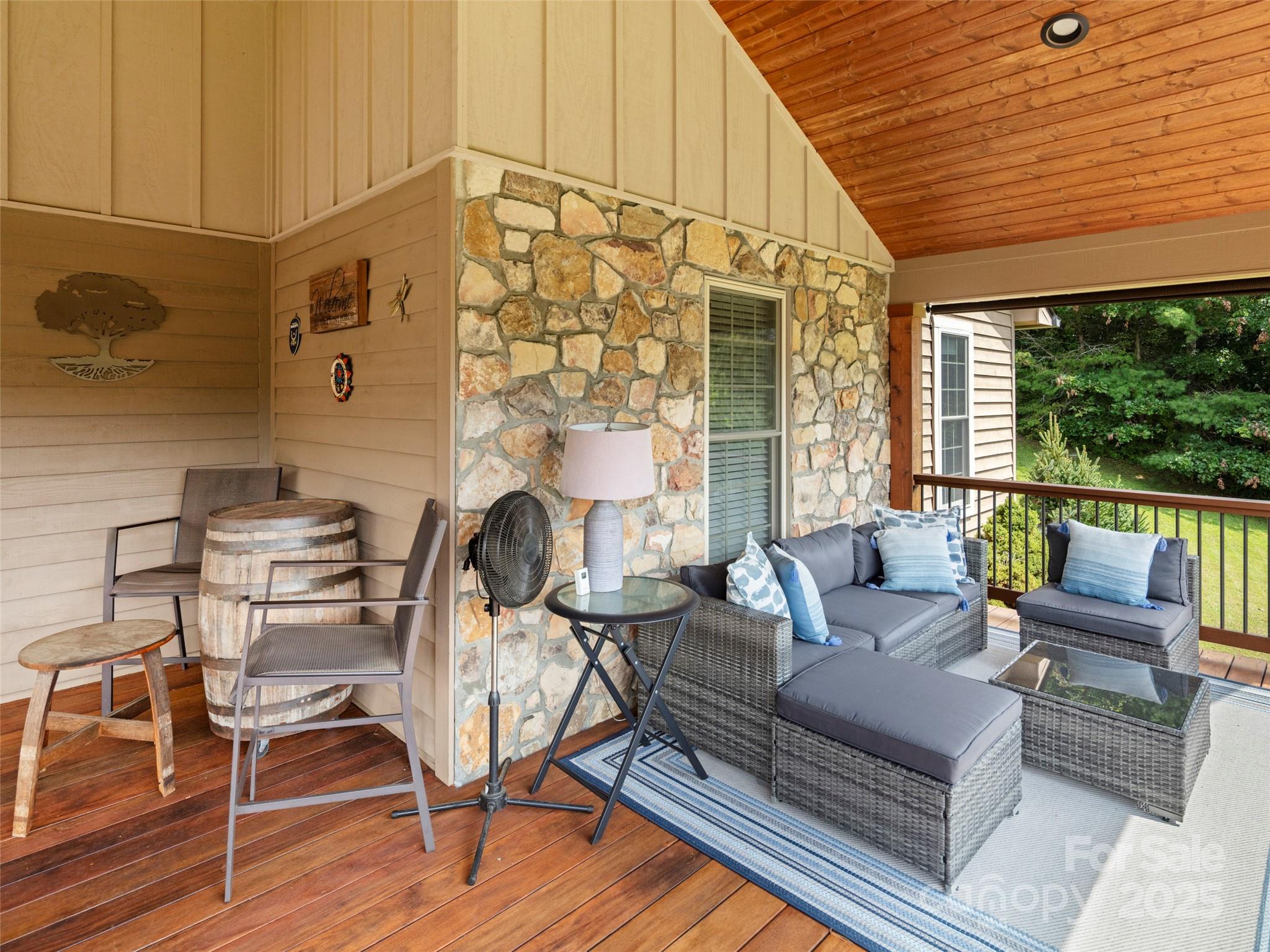 298 Lone Pine Road Alexander, NC 28701 - Photo 23 of 48 a living room with furniture a wooden floor and next to a window