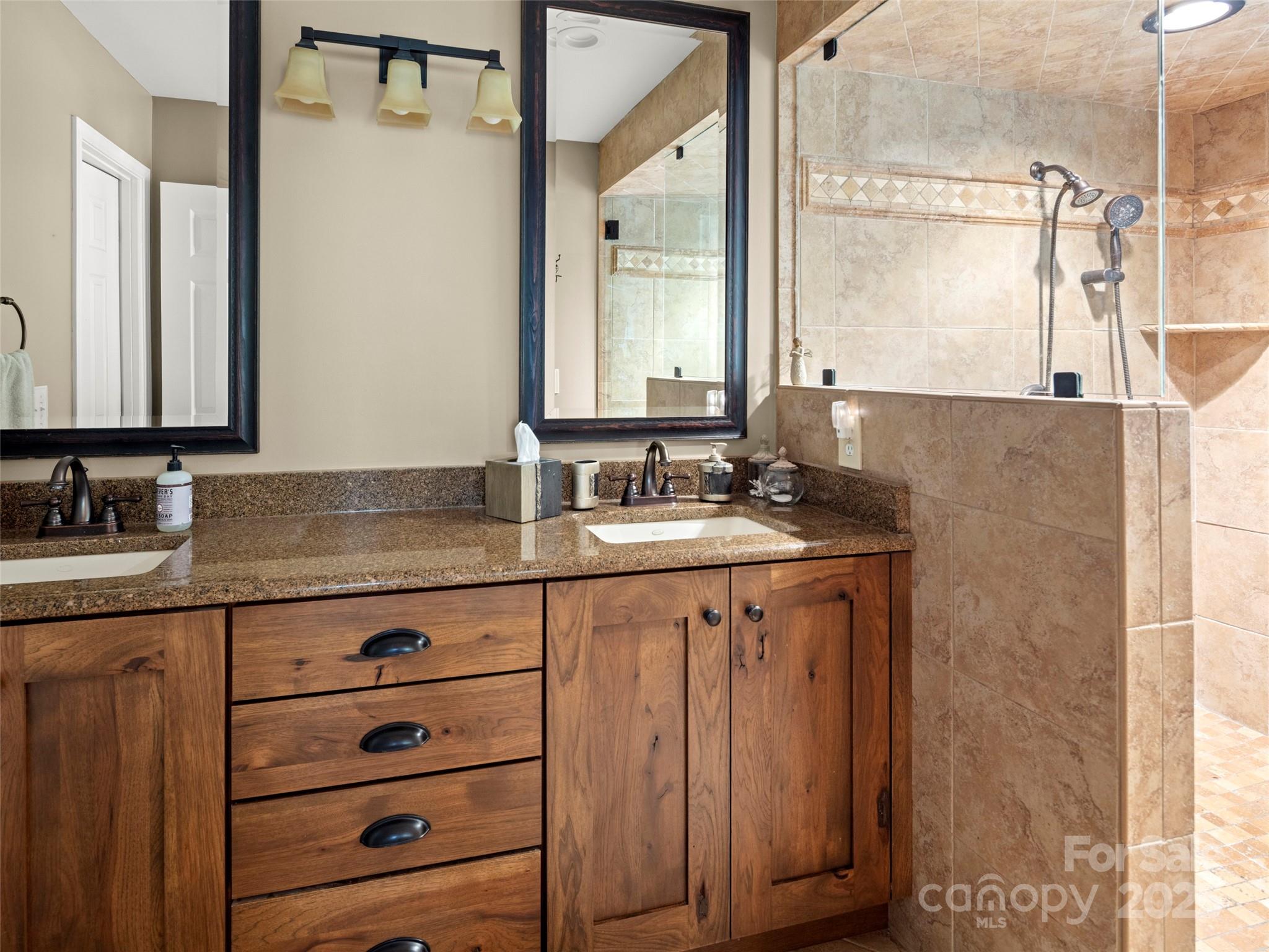 298 Lone Pine Road Alexander, NC 28701 - Photo 26 of 48 a bathroom with a granite countertop sink and a mirror