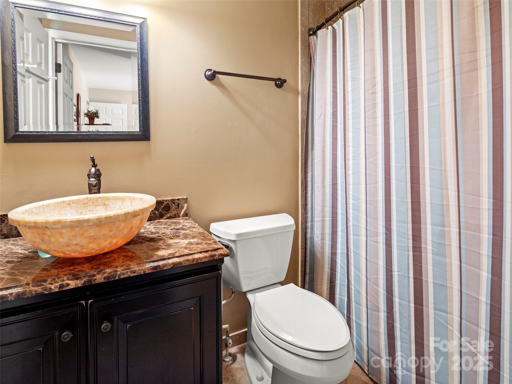 298 Lone Pine Road Alexander, NC 28701 - Photo 30 of 48 a bathroom with a granite countertop sink and a mirror