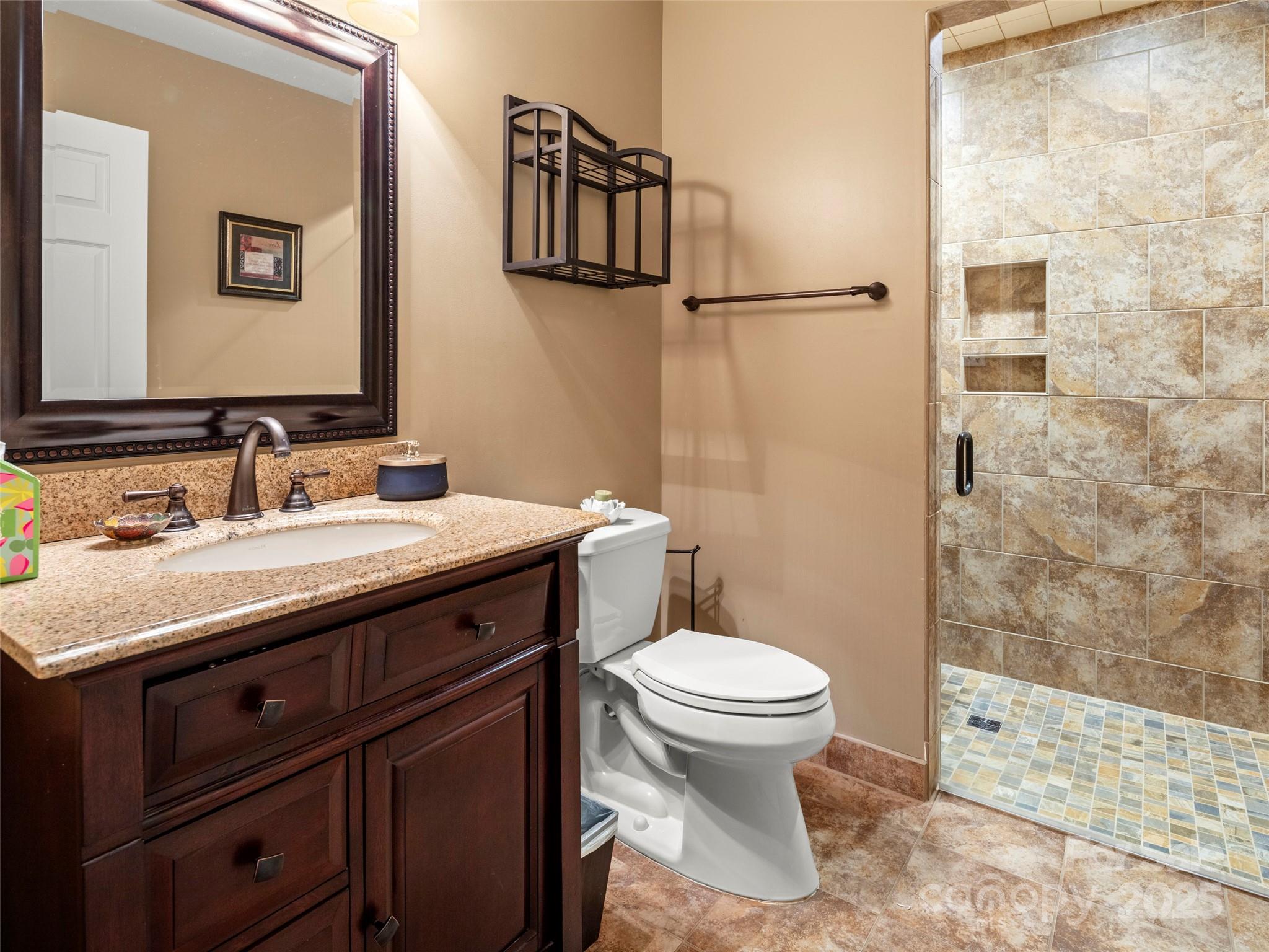 298 Lone Pine Road Alexander, NC 28701 - Photo 32 of 48 a bathroom with a sink toilet and shower
